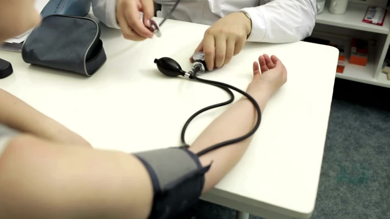 Stock Video Doctor Measuring The Blood Pressure Of A Patient Live Wallpaper For PC - Free Download