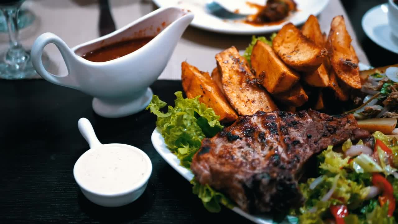 Stock Video Dish Of Meat Potatoes And Salad In A Restaurant Live Wallpaper For PC - Free Download
