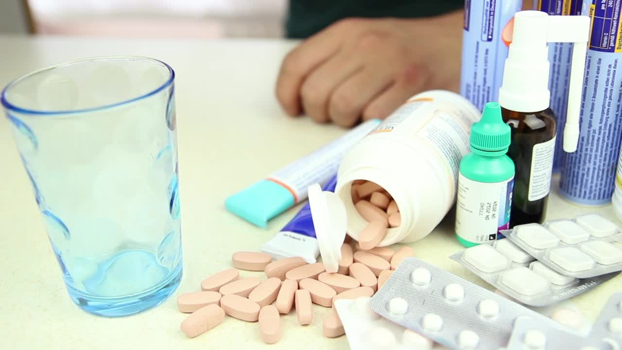 Video Stock Person Taking A Pill Among Other Drugs Live Wallpaper Free - Free Download