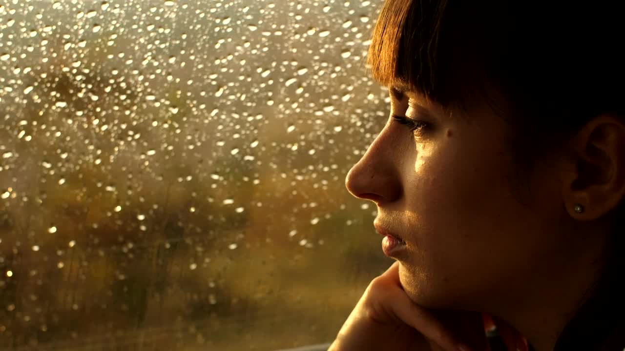 Stock Video Pensive Woman Looking Out Of A Window On A Rainy Live Wallpaper - Free Download