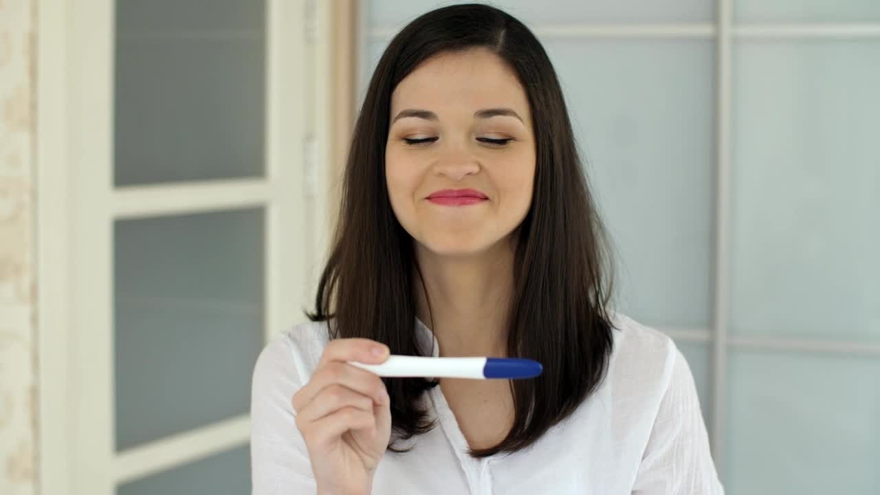 Free Stock Video Woman Rejoices After Seeing Her Pregnancy Test Live Wallpaper - Free Download