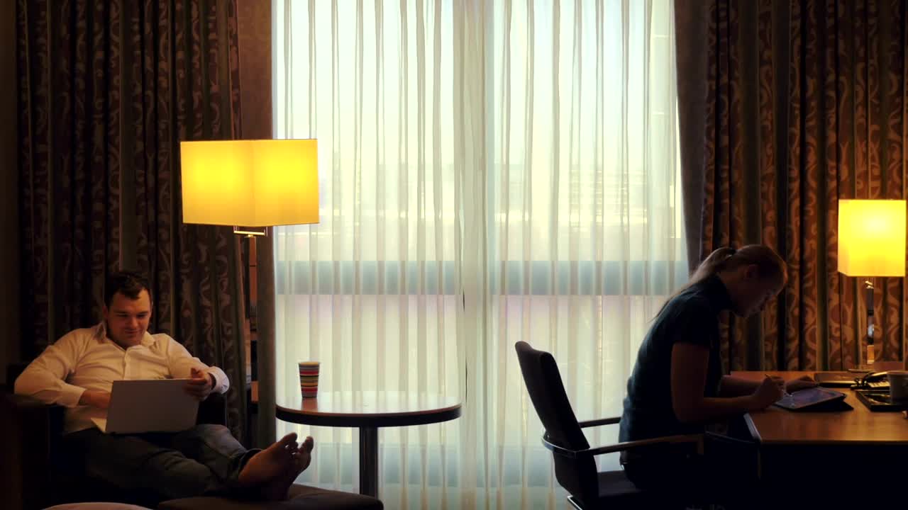 Stock Video Couple Working From A Hotel Room Live Wallpaper For PC - Free Download