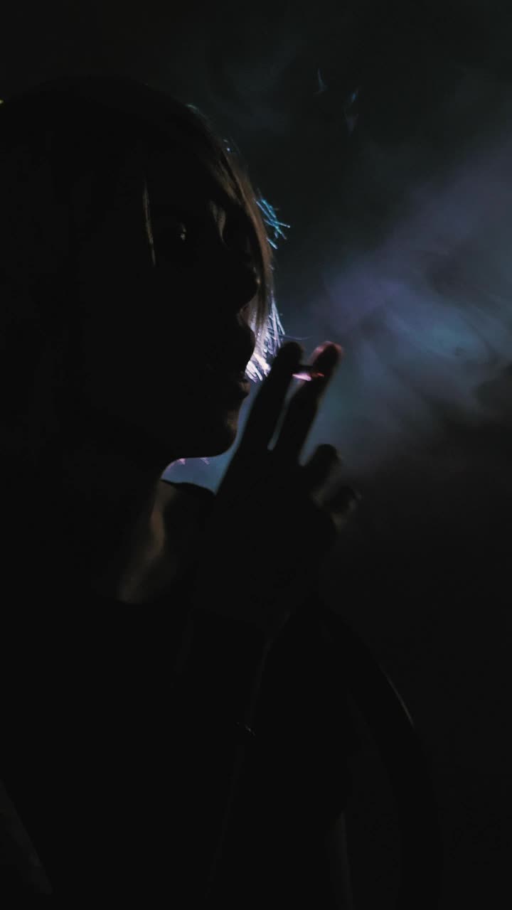 Stock Video Girl Smoking In The Shadows With A Backlight Live Wallpaper For PC - Free Download