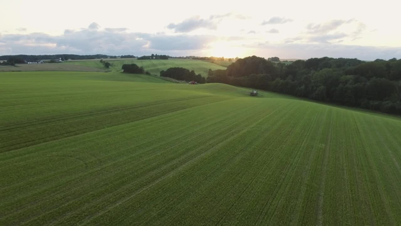Free Video Stock tractor moving through a field Live Wallpaper - Free Download