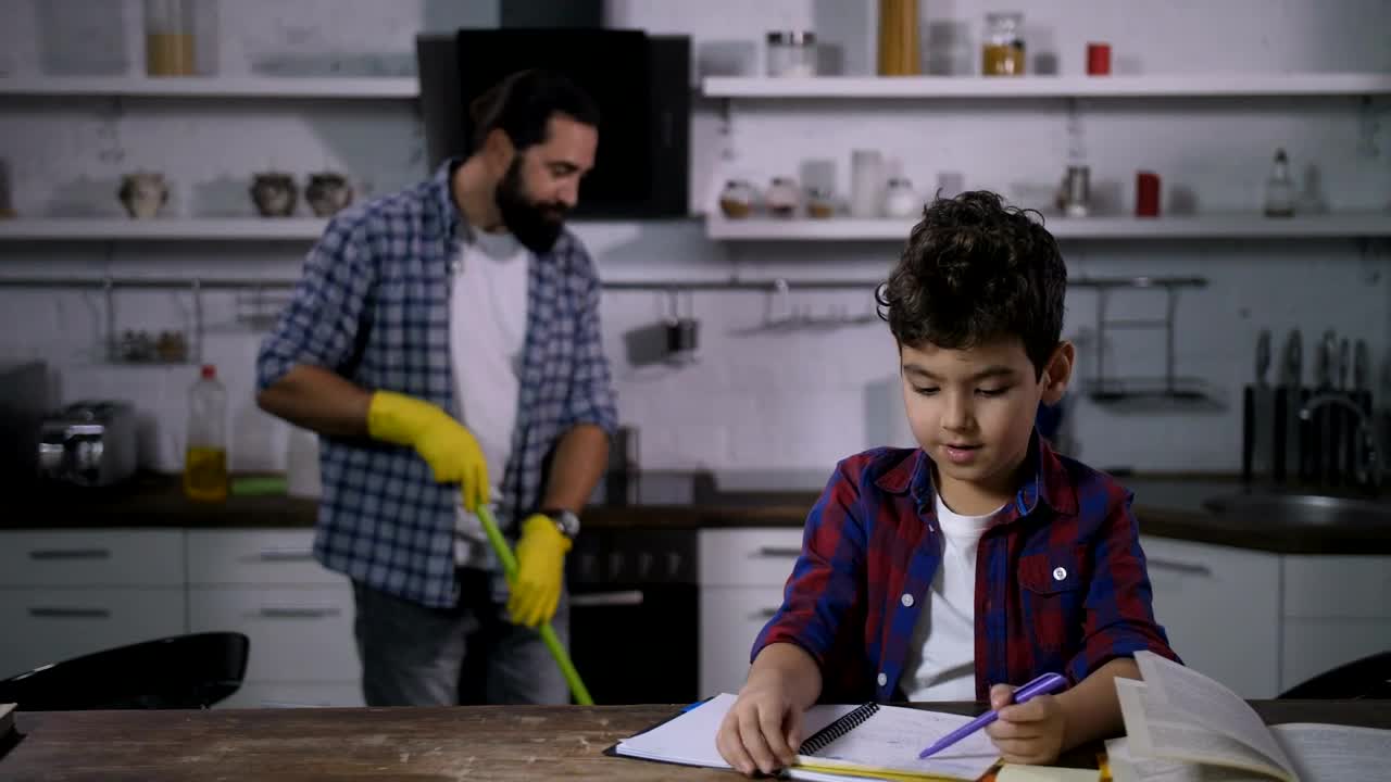 Free Video Stock Son Doing Homework While His Father Cleans Live Wallpaper - Free Download