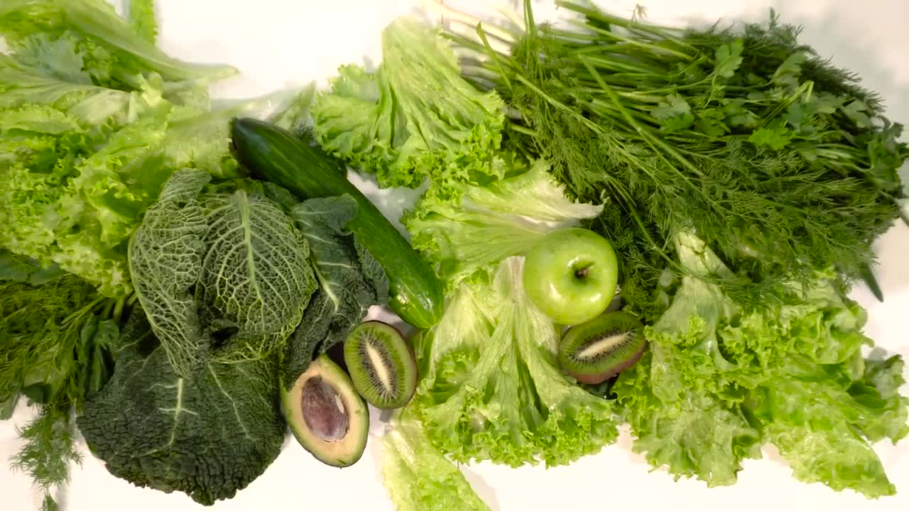 Free Video Stock top view of green fruits and veg on table Live Wallpaper - Free Download