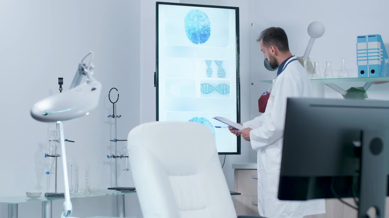 Stock Video Doctor Looks At Screen Showing Dna And Brain Models Live Wallpaper For PC - Free Download