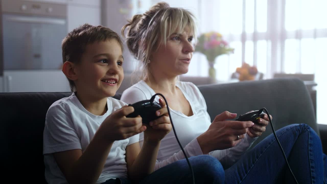 Stock Video Mother And Son Playing An Old Consol Animated Wallpaper - Free Download