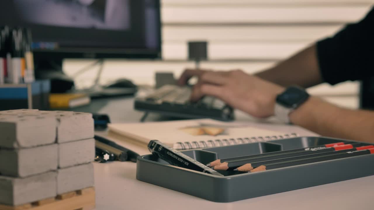 Free Stock Video Working On A Computer Surrounded By Artifacts For Drawing Live Wallpaper - Free Download