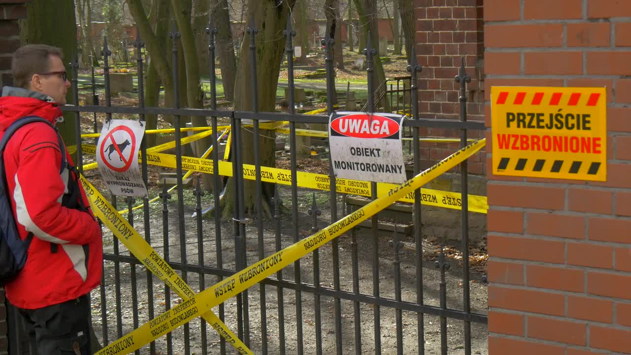 Stock Video Man Looking At A Closed Fence With Warning Sign Animated Wallpaper - Free Download
