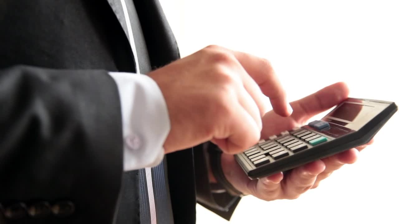Video Stock Businessman Tallying On A Calculator Live Wallpaper For PC - Free Download