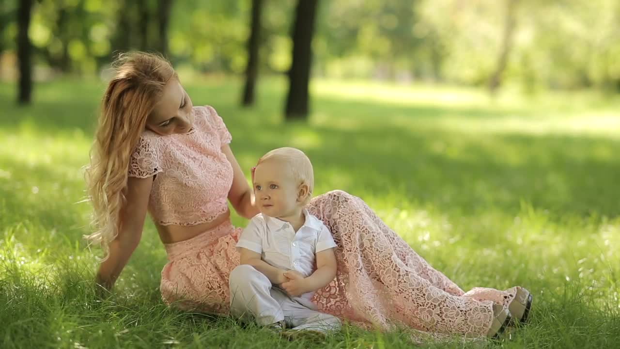Free Stock Video Young Mother Caresses Her Son In The Park Live Wallpaper - Free Download