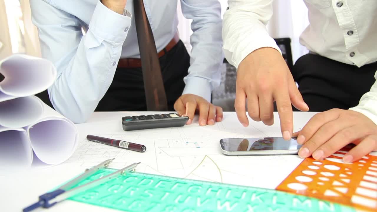 Free Stock Video Two Architects Discussing A Project On A Desk Live Wallpaper - Free Download