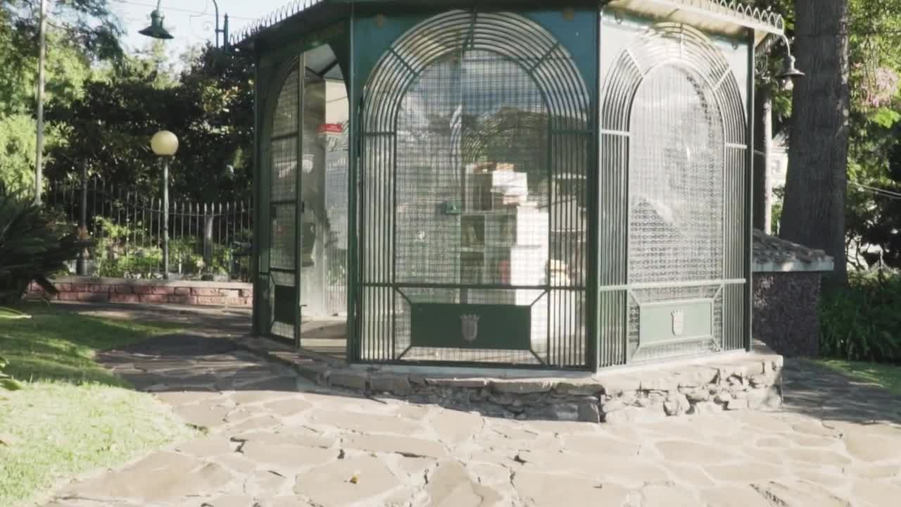 Stock Video Kiosk With Books Inside In A Garden Animated Wallpaper - Free Download