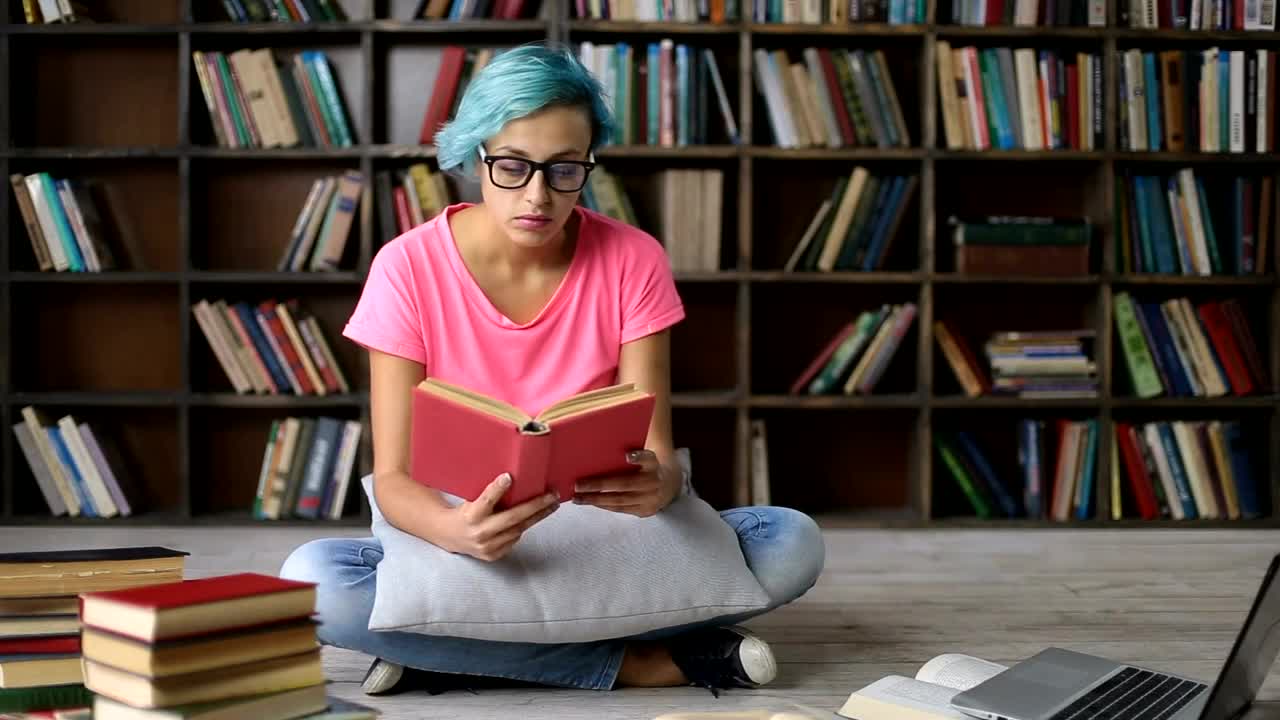 Free Video Stock tired student in the college library Live Wallpaper - Free Download
