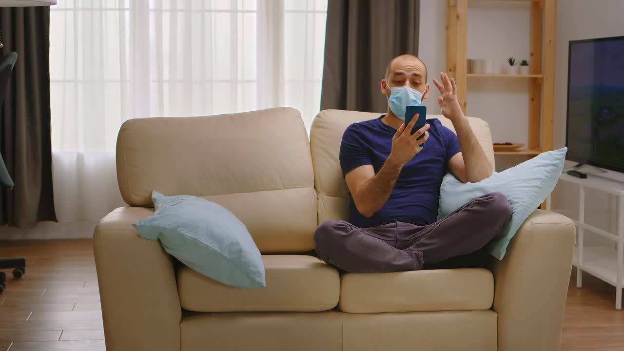 Free Video Stock talking on the phone while wearing a mask Live Wallpaper - Free Download