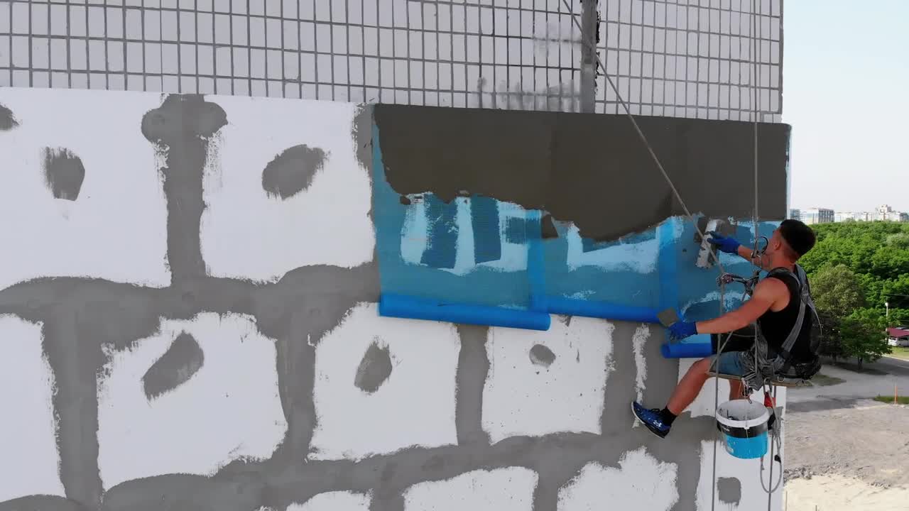 Stock Video Industrial Climber Putting Cement To A Wall Animated Wallpaper - Free Download