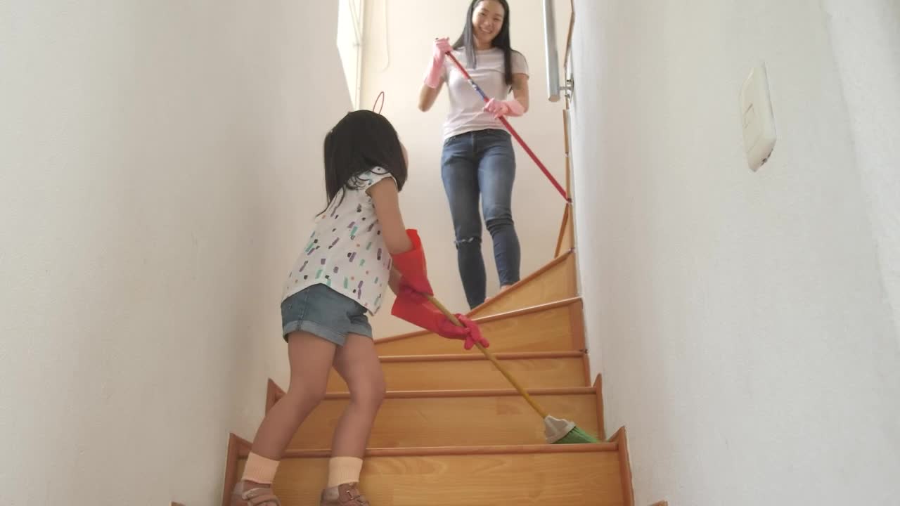 Stock Video Mom And Daughter Sweeping The Stairs At Hom Animated Wallpaper - Free Download