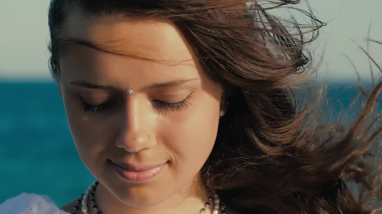 Stock Video Face Of A Cheerful Girl With Watching Near The Sea Live Wallpaper For PC - Free Download