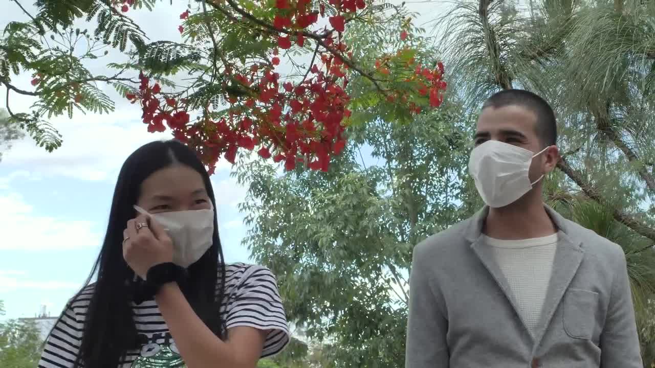Stock Video Couple With Masks Walking In A Park Live Wallpaper For PC - Free Download
