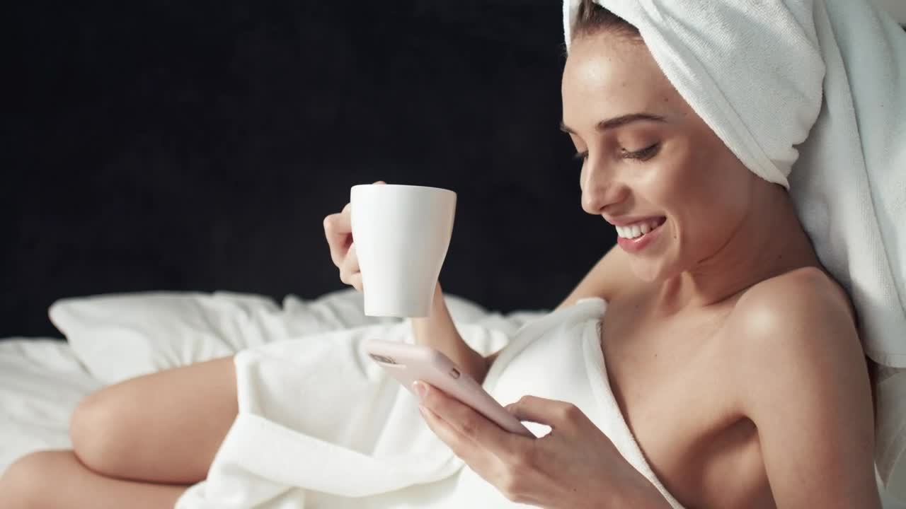 Stock Footage Woman Browsing Social Media After Shower Live Wallpaper - Free Download