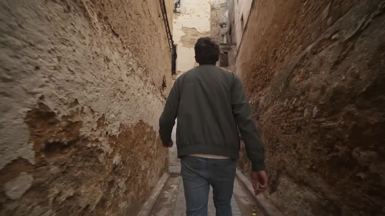 Stock Video Man Exploring Urban Corridors In Morocco Animated Wallpaper - Free Download
