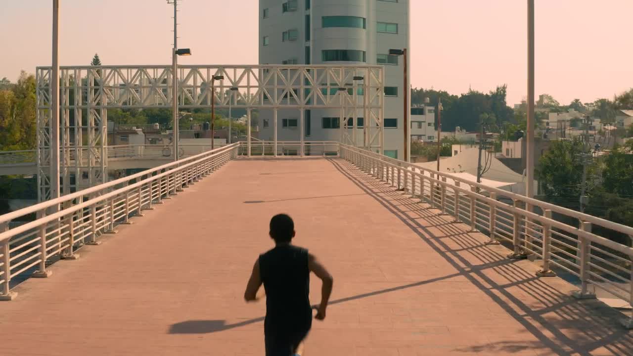 Stock Video Man Jogging On A Pedestrian Bridge In The Cit Animated Wallpaper - Free Download