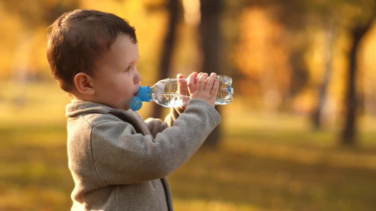 Stock Video Little Boy Drinking Water From A Bottle Animated Wallpaper - Free Download
