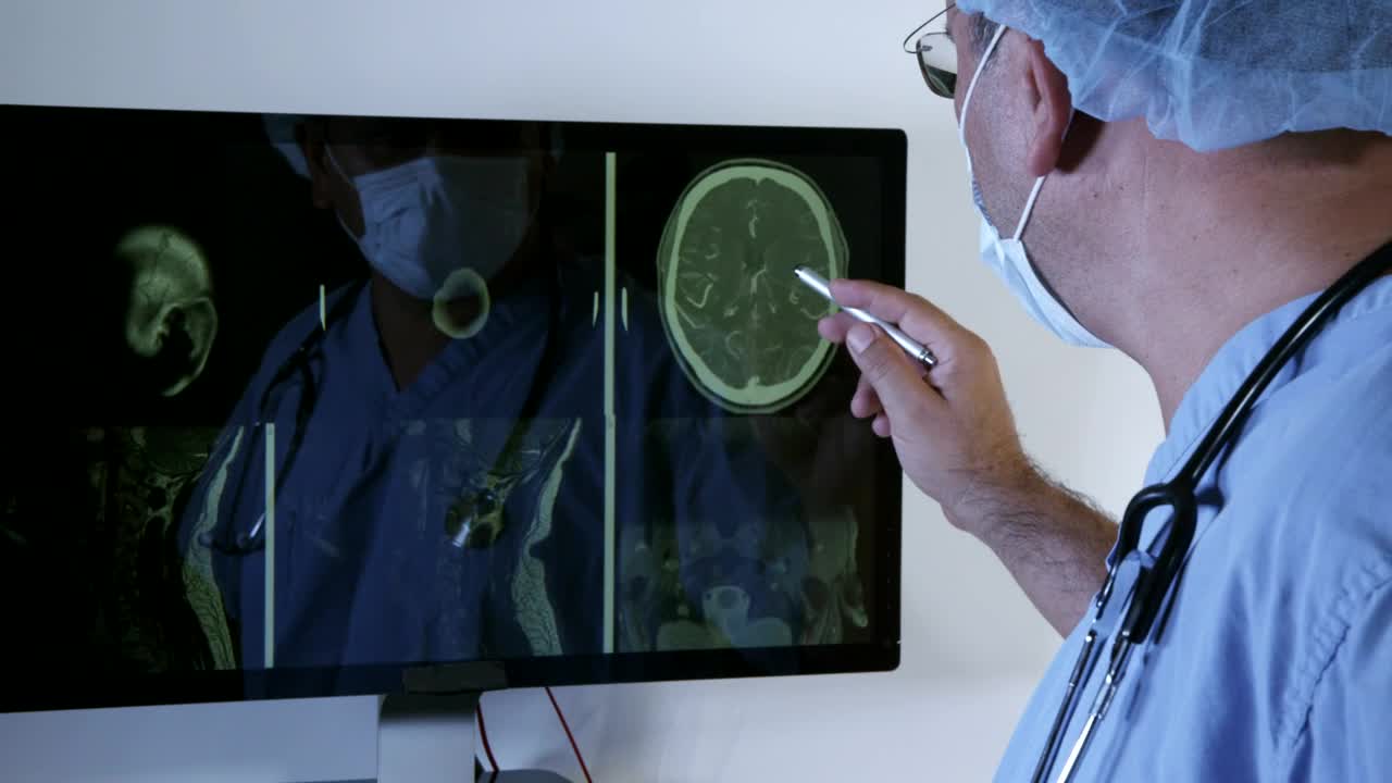 Stock Video Doctor Assessing Scan Results Live Wallpaper For PC - Free Download