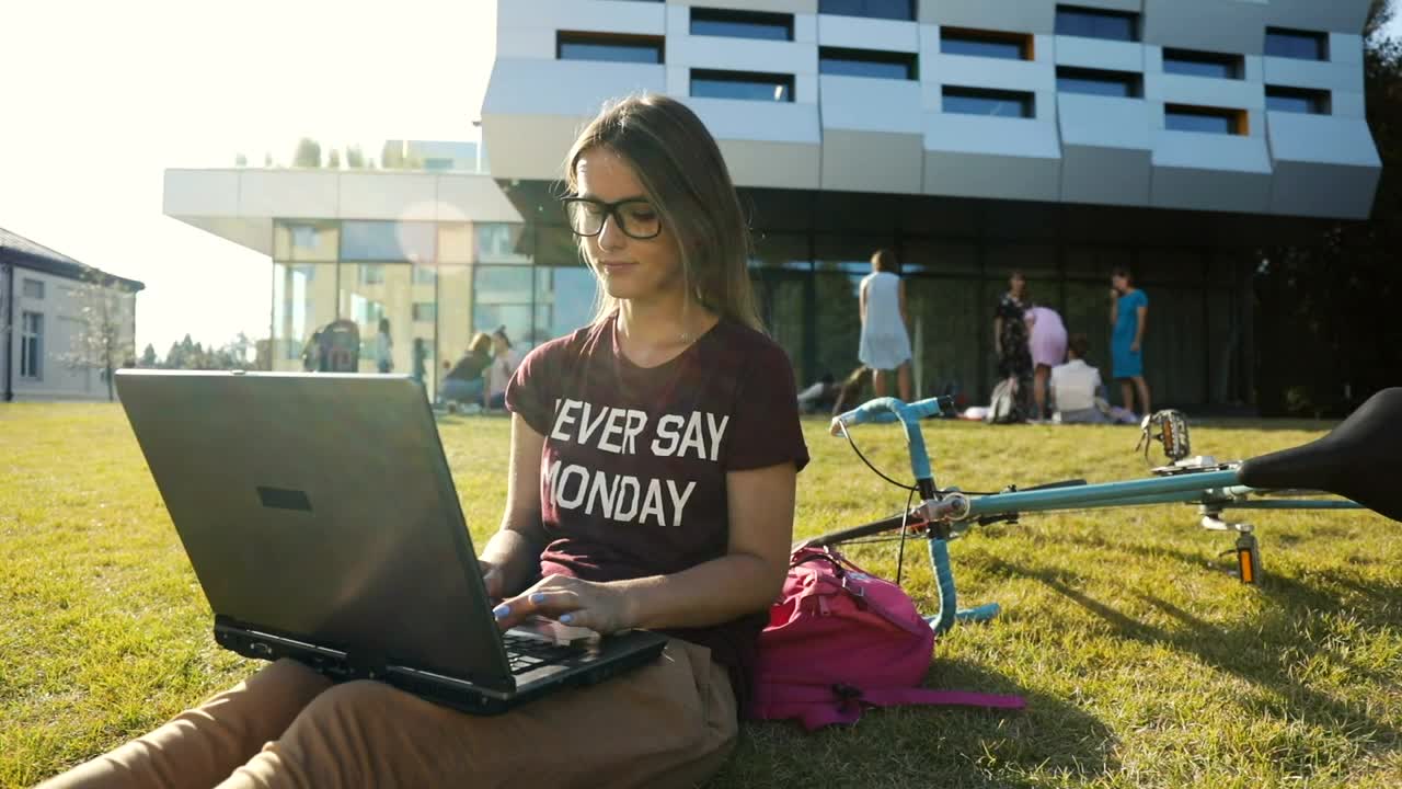 Stock Video Girl Types On Laptop Outside University Building Live Wallpaper For PC - Free Download