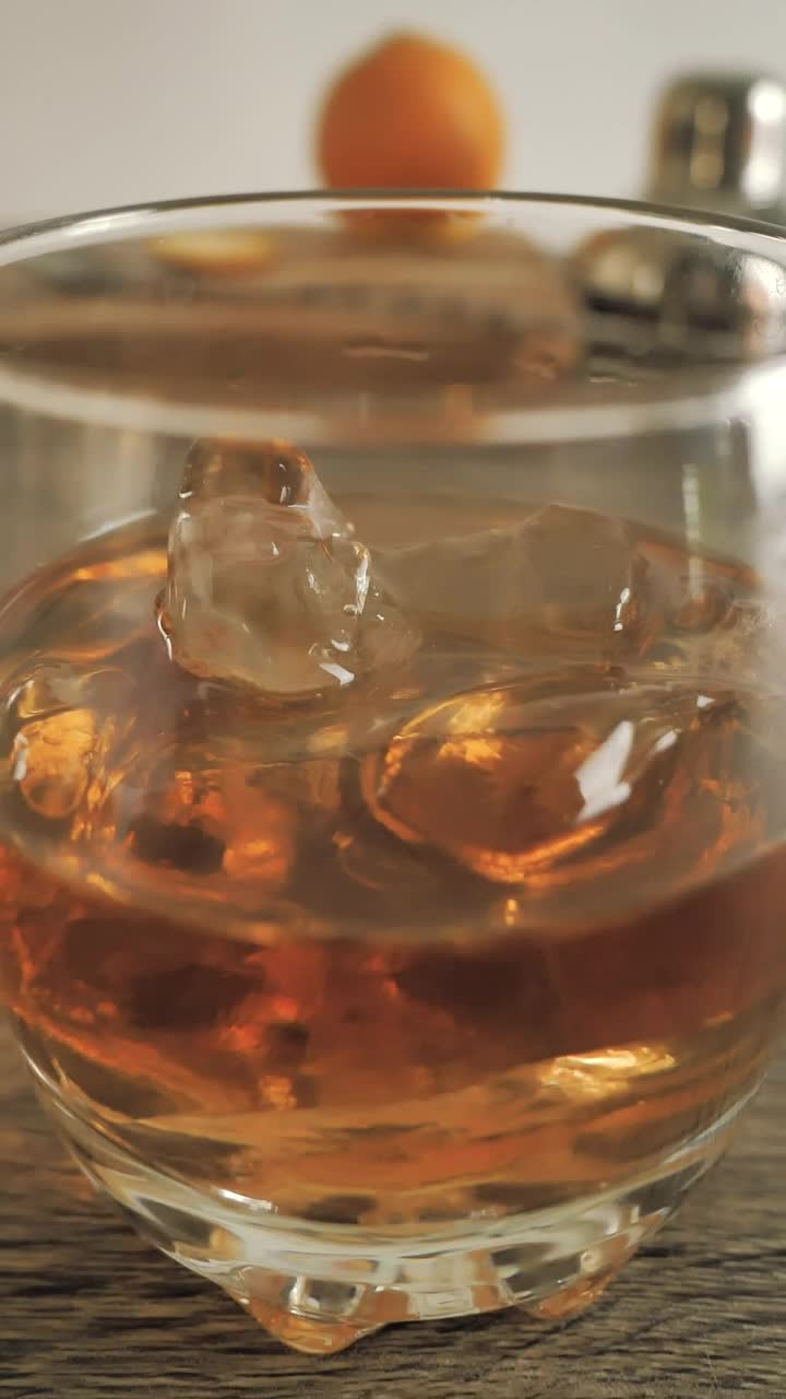 Free Video Stock Small Glass With Whiskey On The Rocks Live Wallpaper - Free Download