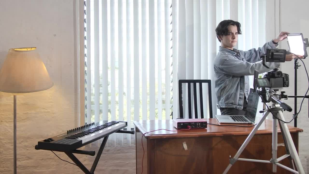 Free Stock Video Young Man Preparing A Film Set In An Office Live Wallpaper - Free Download