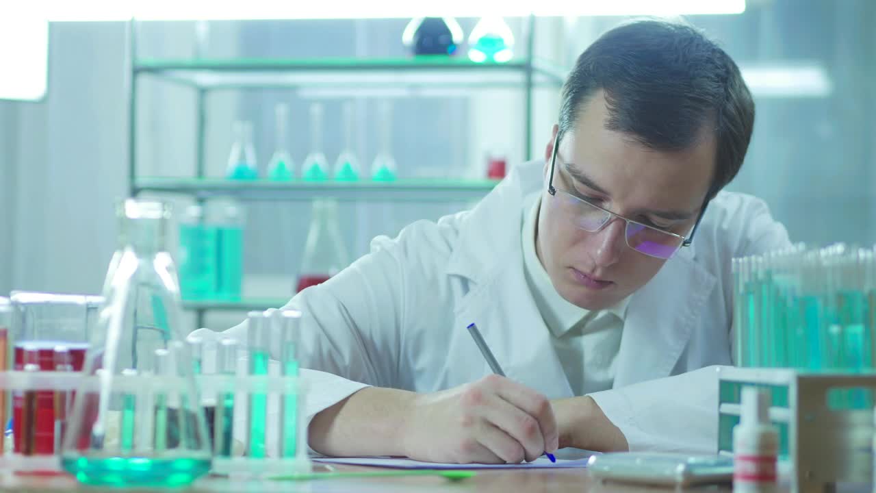 Free Stock Video Scientist Writing In The Lab Live Wallpaper - Free Download