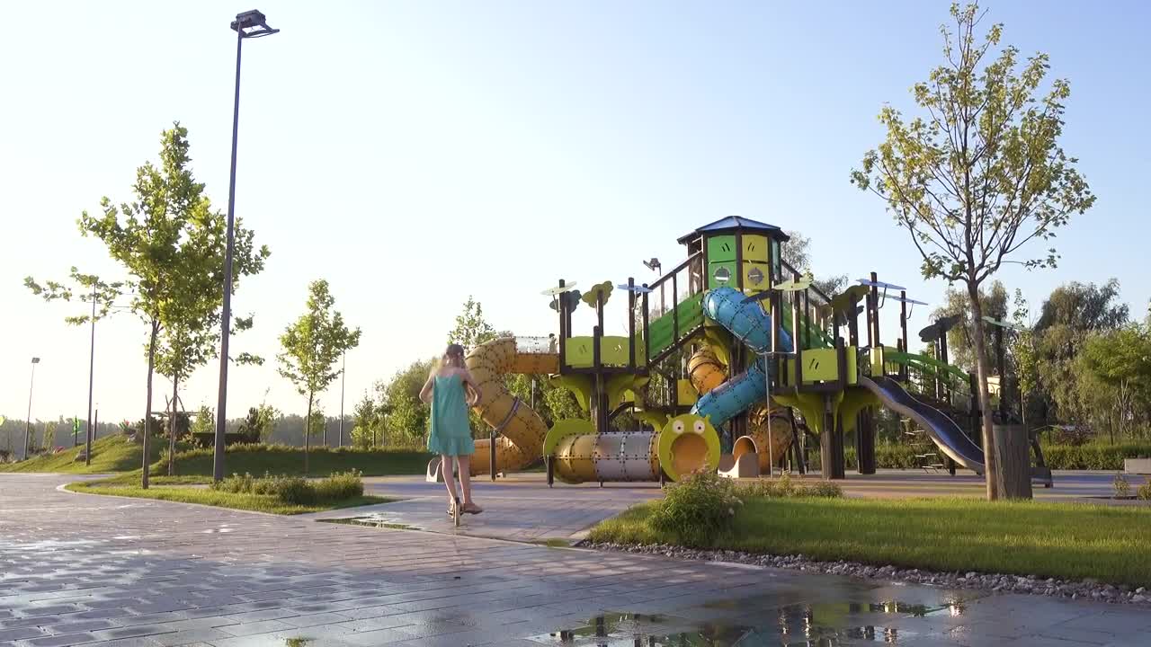 Stock Video Little Girl Riding A Scooter In The Park Animated Wallpaper - Free Download