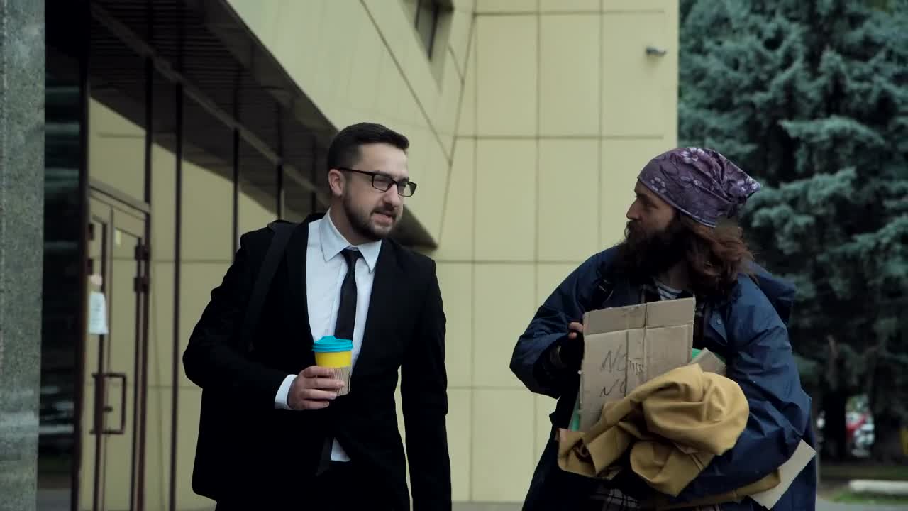 Video Stock Businessman Walking With A Beggar In The Street Live Wallpaper For PC - Free Download