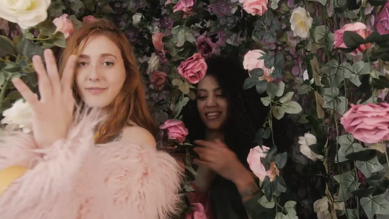Video Stock Portrait Of Two Funny Girls Among Many Flowers Live Wallpaper Free - Free Download