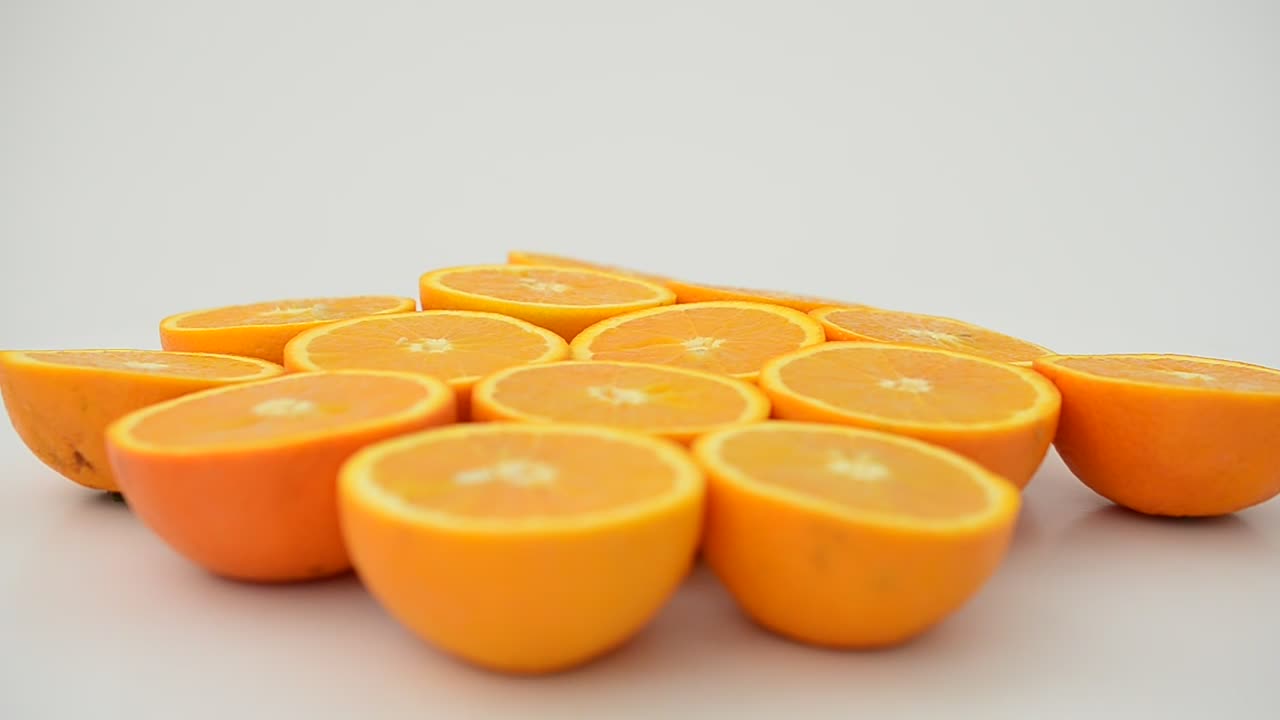Free Video Stock Split Oranges Rotating On A White Background Live Wallpaper - Free Download