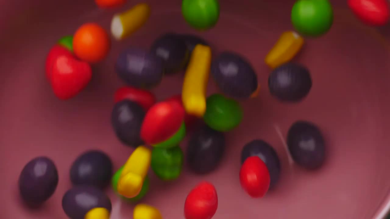 Stock Video Fruit Shaped Candies Falling Into Bowl Live Wallpaper For PC - Free Download