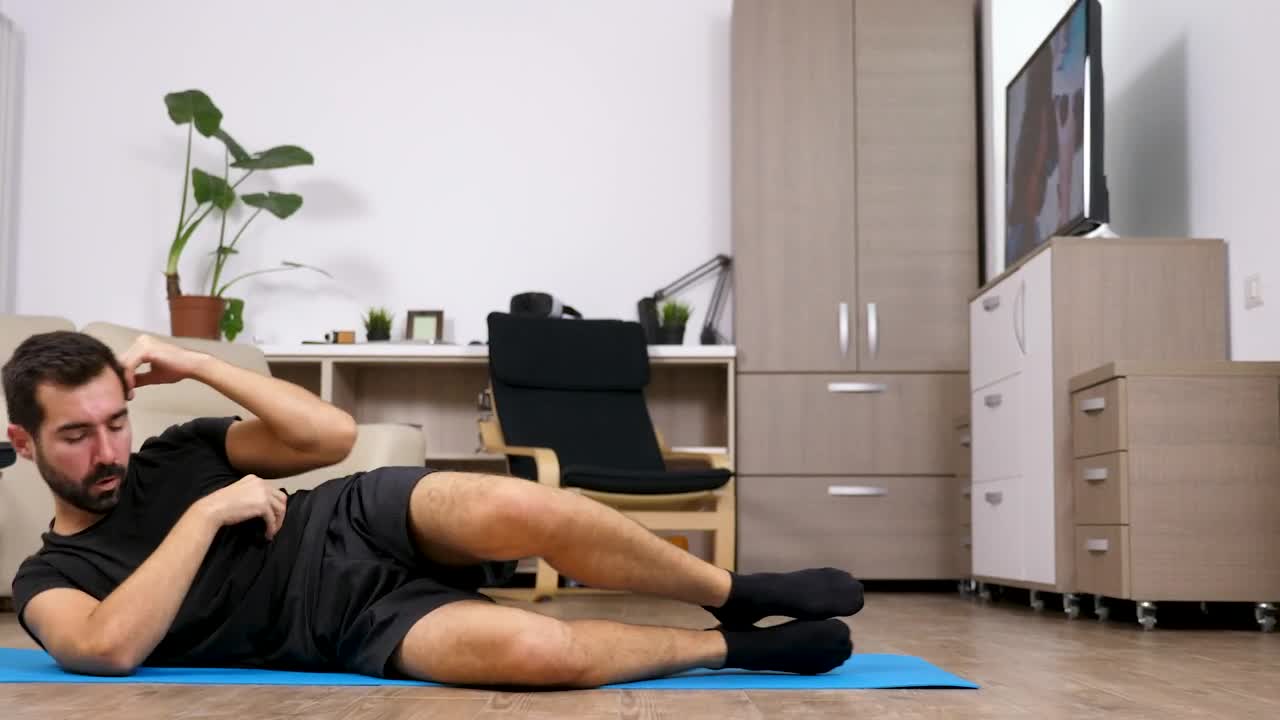 Stock Video Motivated Man Exercises On Floor At Home Live Wallpaper - Free Download