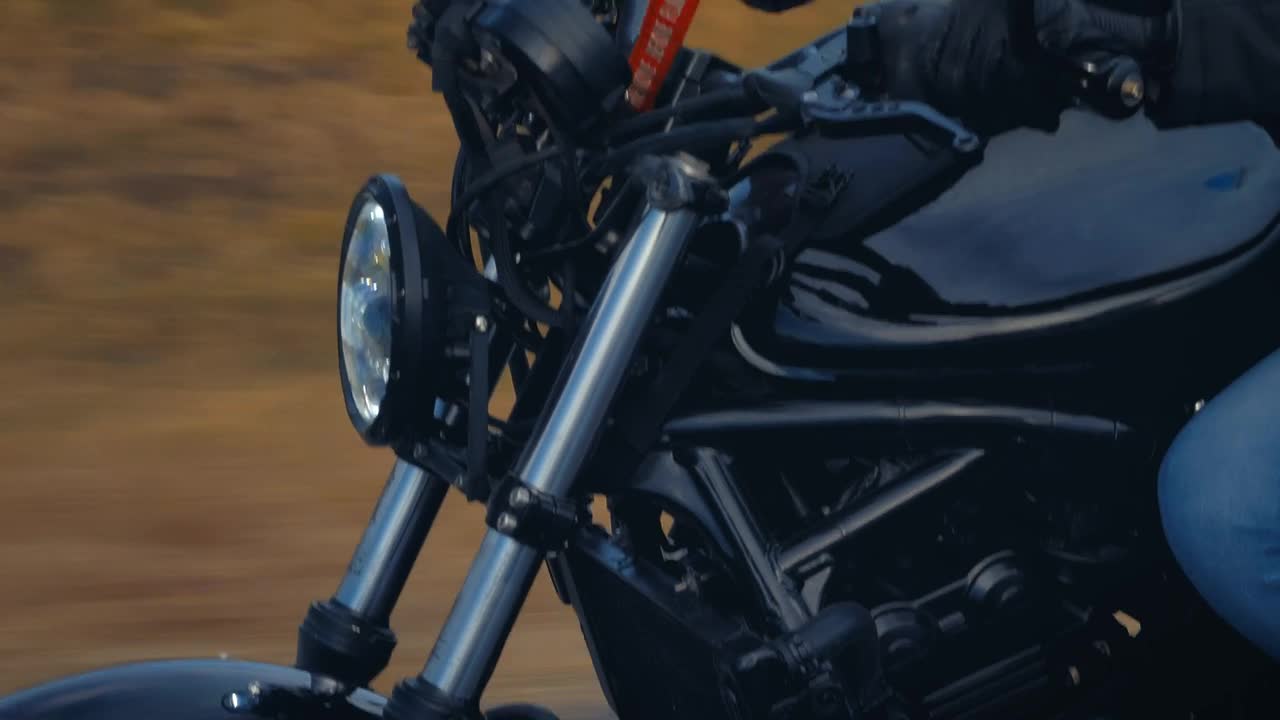 Stock Video Motorcycle And Its Driver Speeding Down A Road Live Wallpaper - Free Download