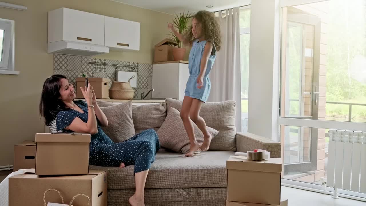 Free Stock Video Woman Records Her Daughter Jumping On The Couch Live Wallpaper - Free Download