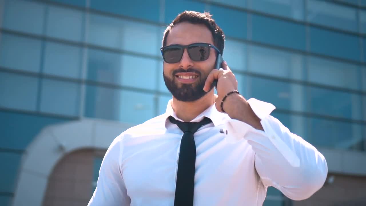 Stock Video Dubai Businessman In Sunglasses On Mobile Phone Live Wallpaper For PC - Free Download