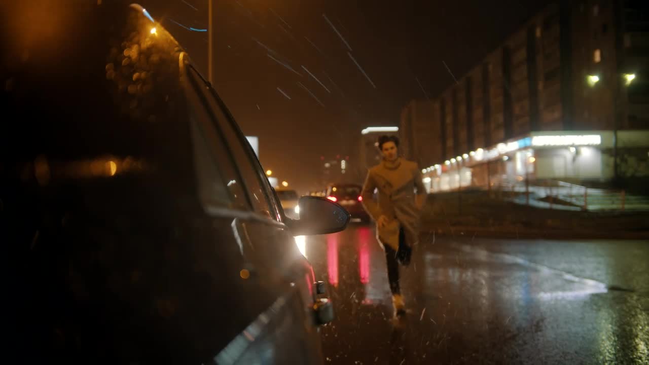 Stock Video Man Runs To Get In His Car On A Rain Animated Wallpaper - Free Download