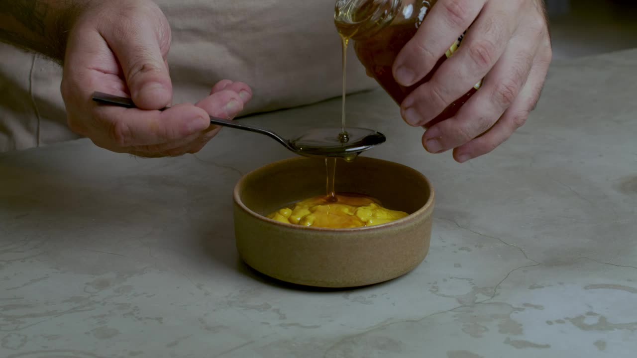 Stock Video Pastry Chef Adding Honey To A Mixture Live Wallpaper - Free Download