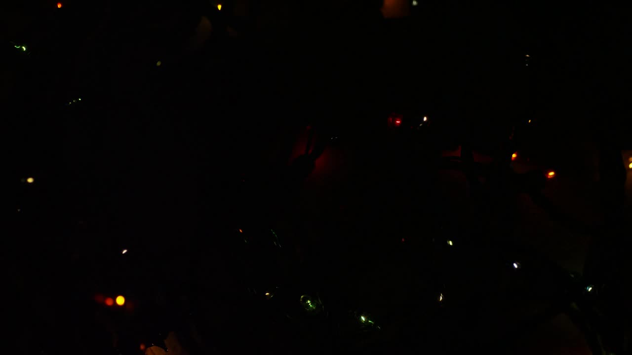 Stock Video Ornamental Christmas Lights In A Dark Room Live Wallpaper - Free Download