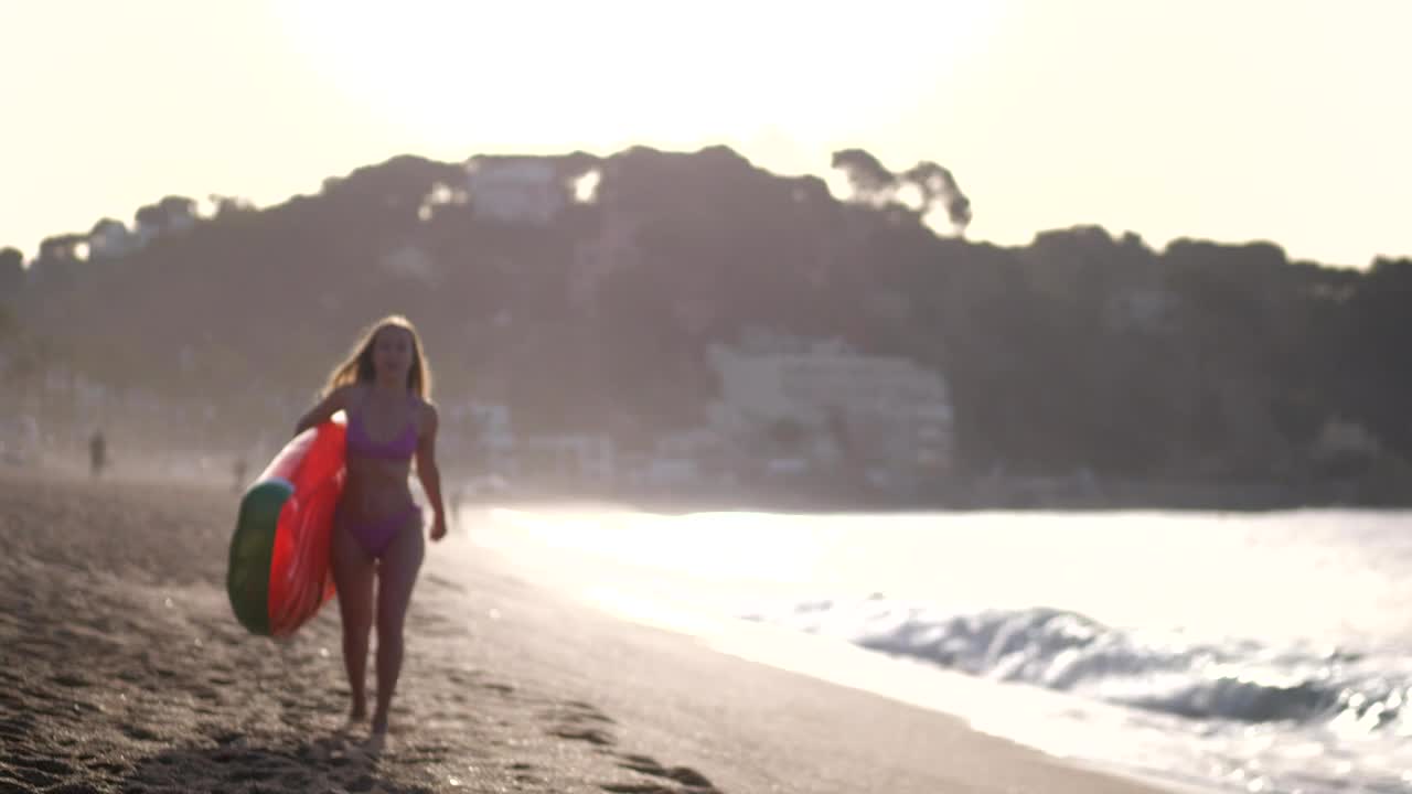 Stock Footage Woman Carrying A Beach Inflatable Live Wallpaper - Free Download