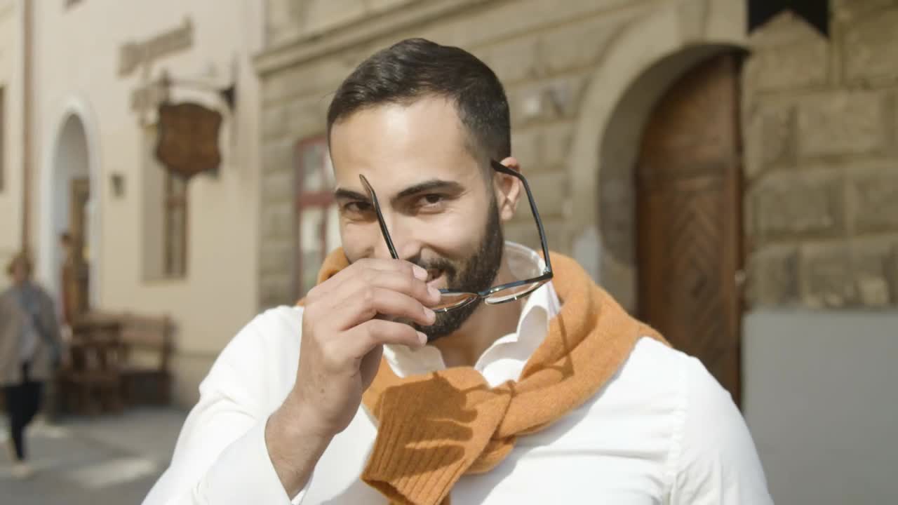 Stock Video Handsome Arab Man Takes Off Glasses And Smiles Animated Wallpaper - Free Download