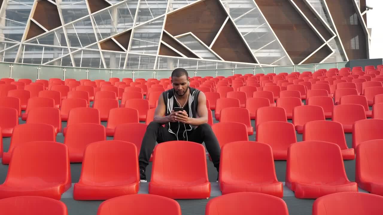 Stock Video Man Sits In Orange Chair Listening To Musi Animated Wallpaper - Free Download