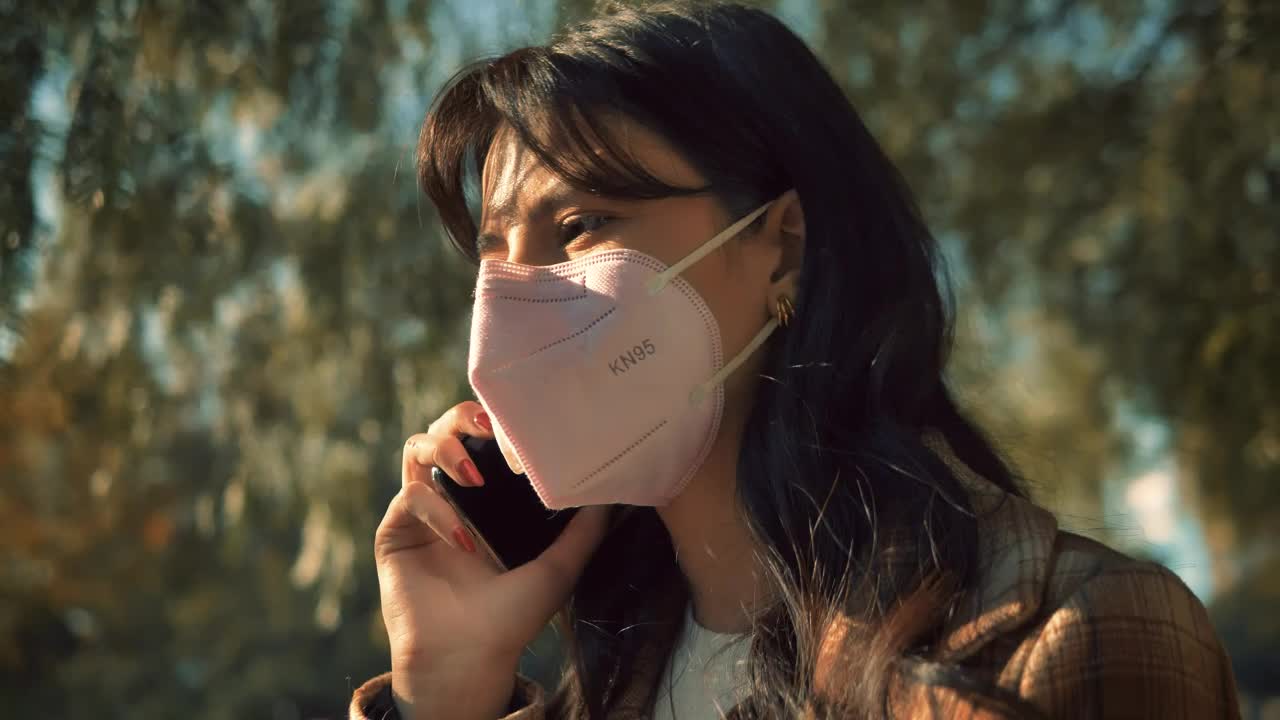 Stock Video Girl With Face Mask Talking On The Cellphone Live Wallpaper For PC - Free Download