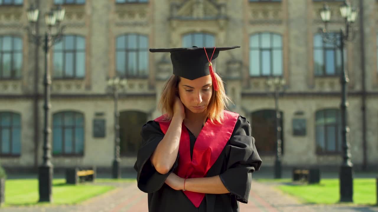 Stock Video Graduate In Cap And Gown Thinks About Future Live Wallpaper For PC - Free Download